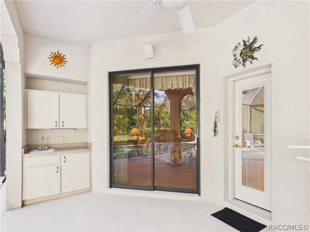 37 Livingstone Daisy Court, Homosassa, FL 34446 LANAI 1 SLIDING DOOR ACCESS TO MASTER BEDROOM WITH A SMALL KICHENETTE