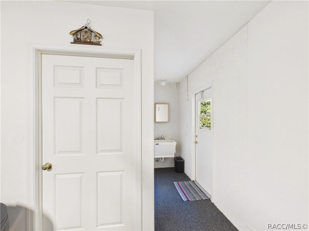 37 Livingstone Daisy Court, Homosassa, FL 34446 GARAGE 3 HAS SINK AND ACCESS TO THE BACK SIDE YARD