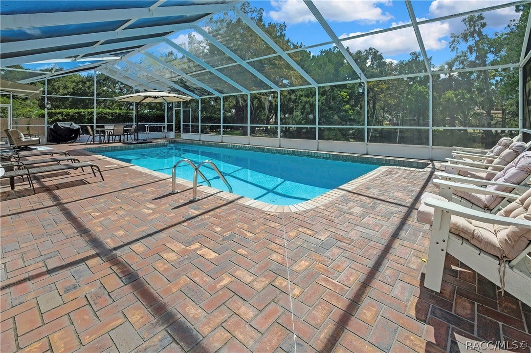 11806 W Riverhaven Drive, Homosassa, FL 34448 Brick paver patio surrounding the pool.
