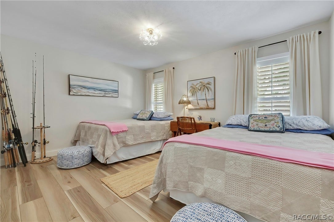 11806 W Riverhaven Drive, Homosassa, FL 34448 Guest bedroom with two beds.