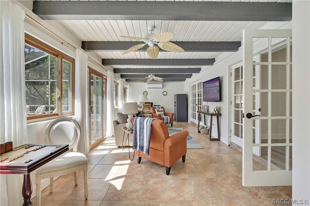 11806 W Riverhaven Drive, Homosassa, FL 34448 Second living area with beamed ceilings and French doors.