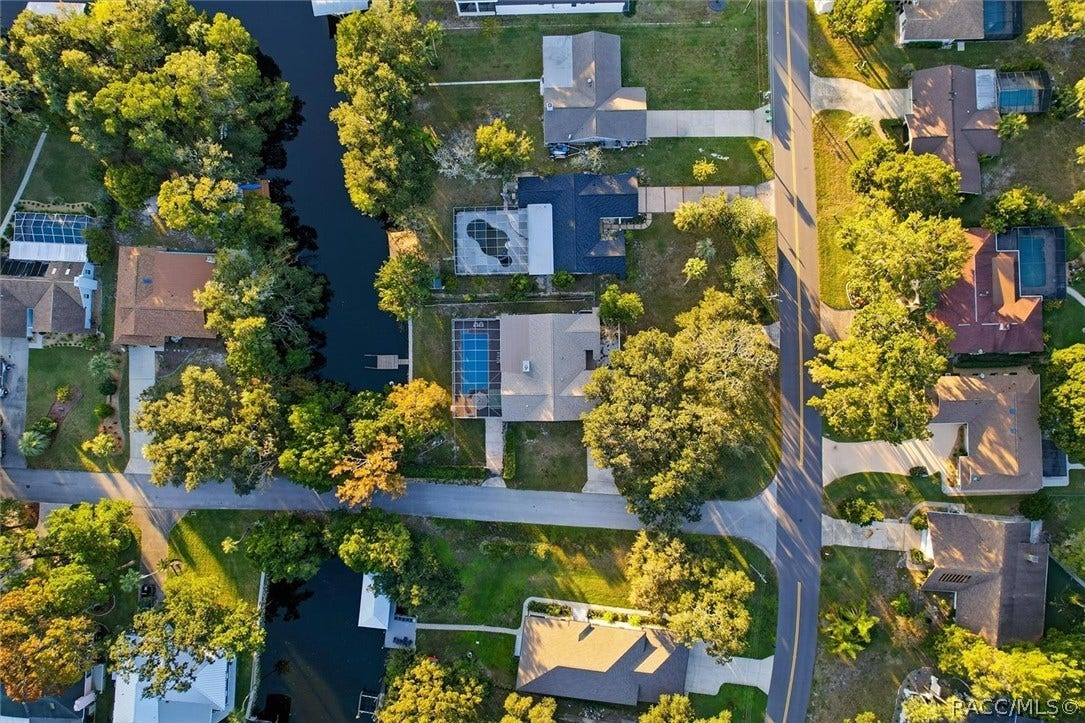 11806 W Riverhaven Drive, Homosassa, FL 34448 Overhead aerial of the home, pool, and canal.