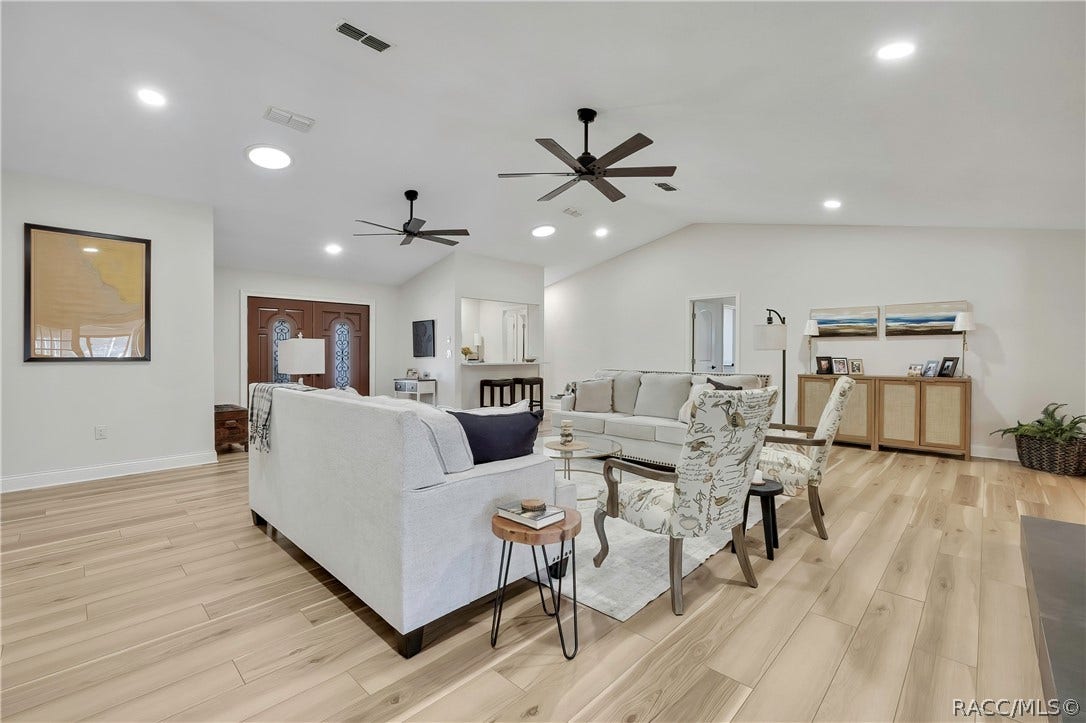 11806 W Riverhaven Drive, Homosassa, FL 34448 Open-concept living, dining, and kitchen area.
