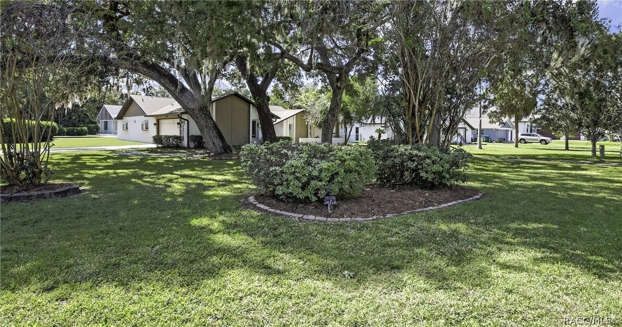 11806 W Riverhaven Drive, Homosassa, FL 34448 Front of the home from across the lawn.