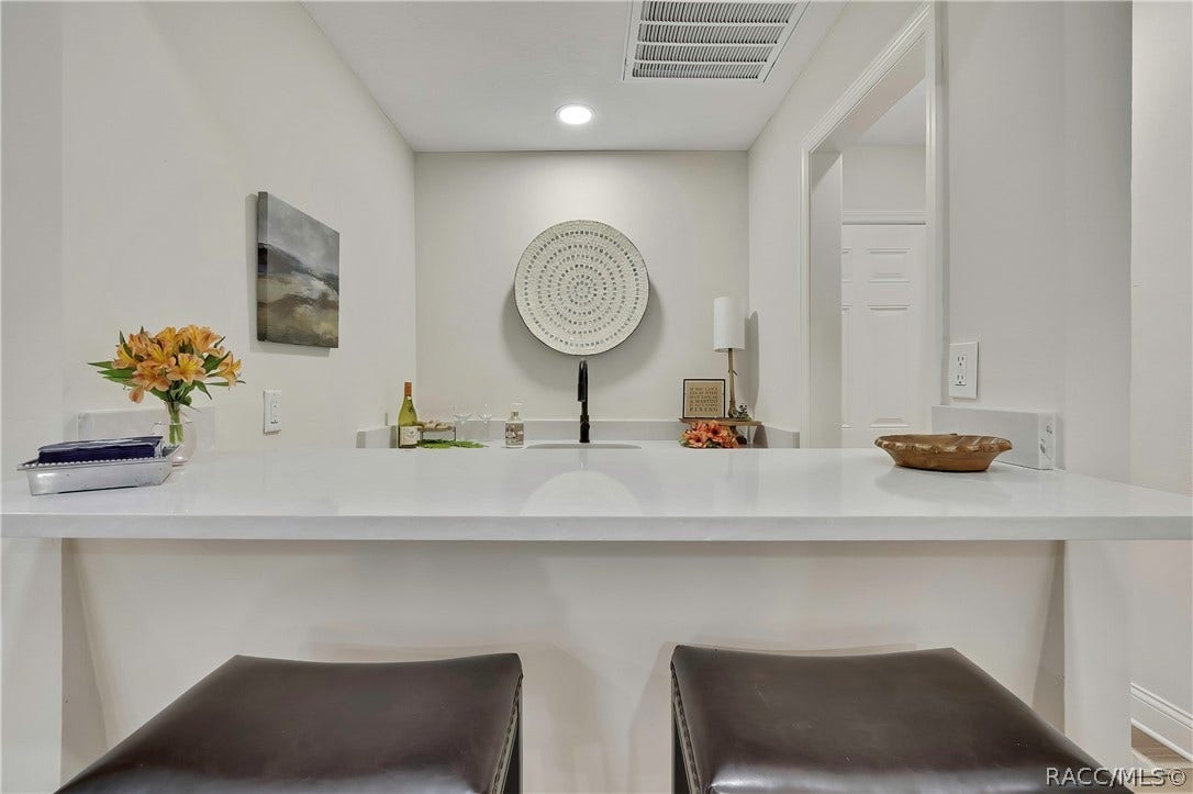 11806 W Riverhaven Drive, Homosassa, FL 34448 Bar counter with seating for two.