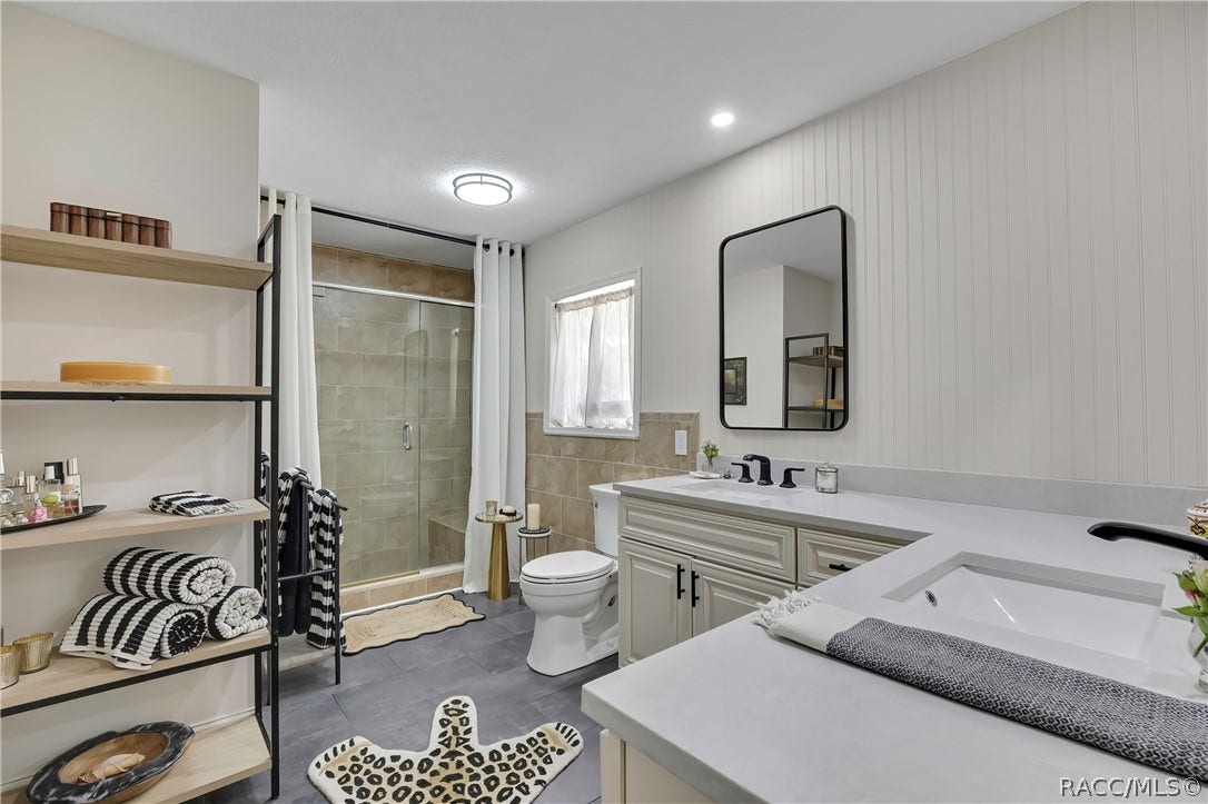 11806 W Riverhaven Drive, Homosassa, FL 34448 Primary bathroom with vanity and glass shower