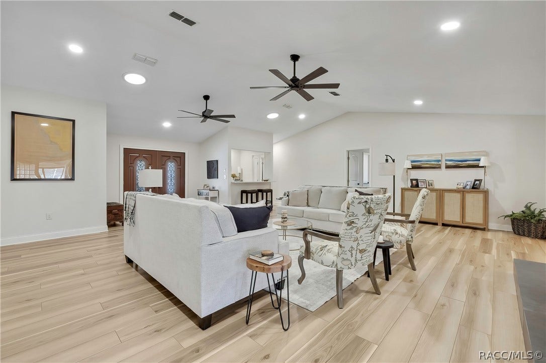 11806 W Riverhaven Drive, Homosassa, FL 34448 Open-concept living, dining, and kitchen area.