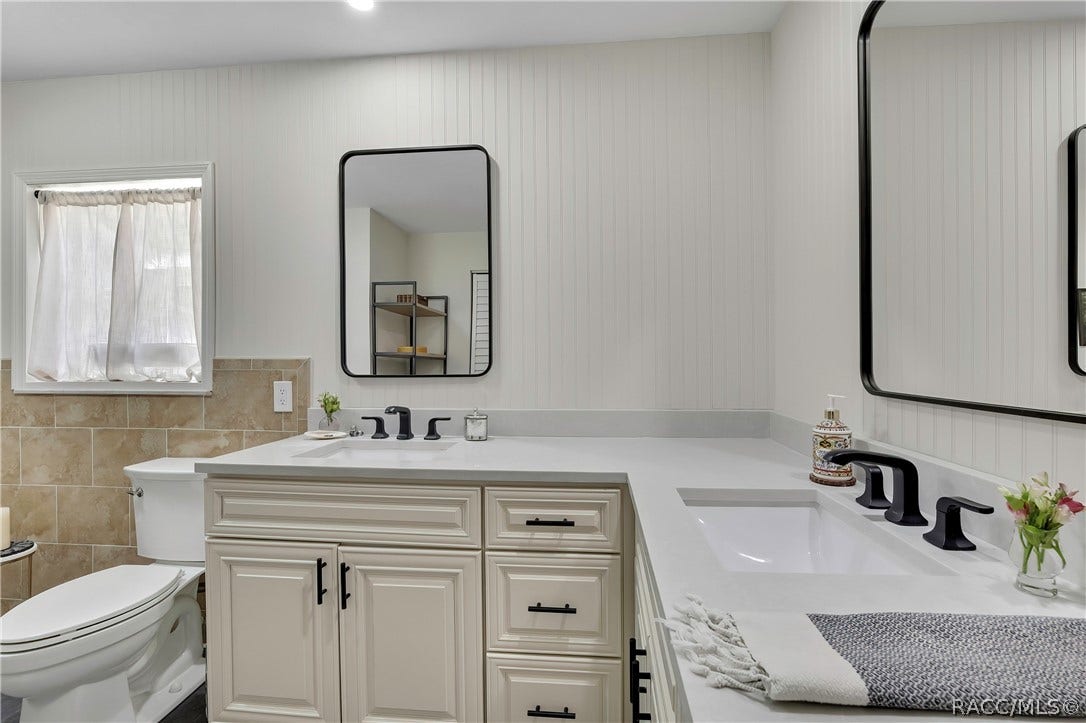 11806 W Riverhaven Drive, Homosassa, FL 34448 Bathroom with vanity, toilet