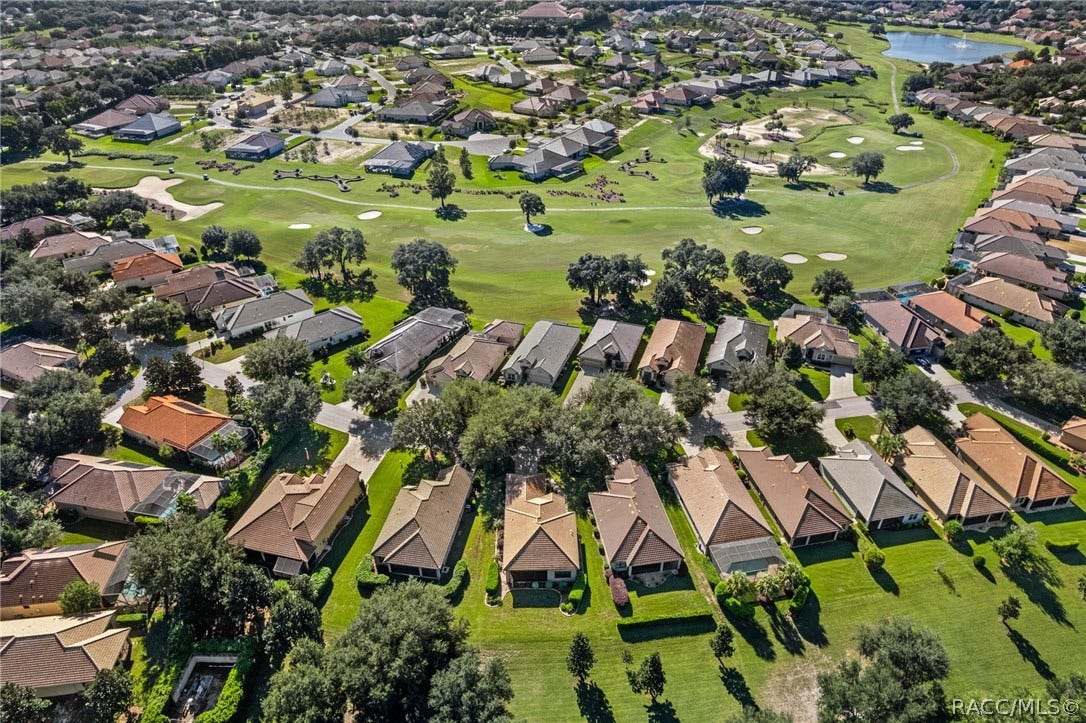 Expanded aerial view of Westford Villas and a peak at the Skyview Golf Course located behind the homes just across the street.