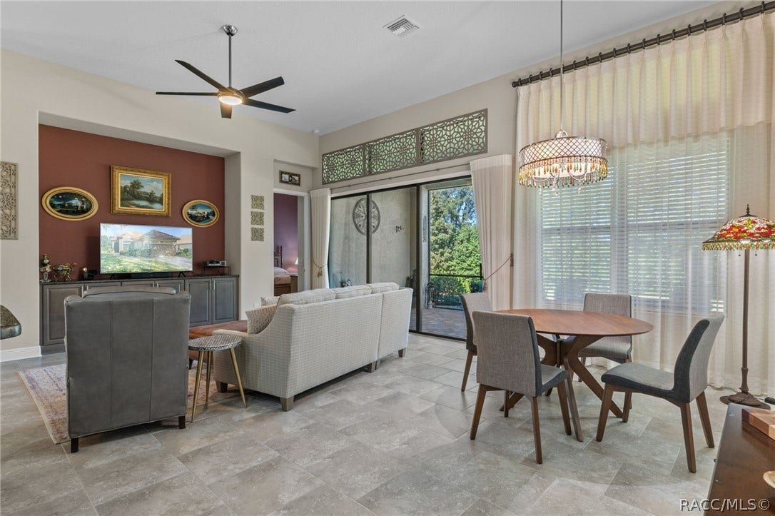 The greatroom is open to the kitchen on one side and the lanai on the other. Open the sliding doors much of the year and immediately expand your living area.