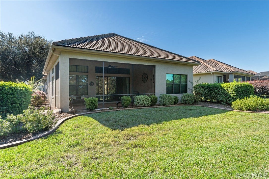 View from opposite side of the backyard accentuates the additional landscape and curbing, another upgraded feature the seller added.