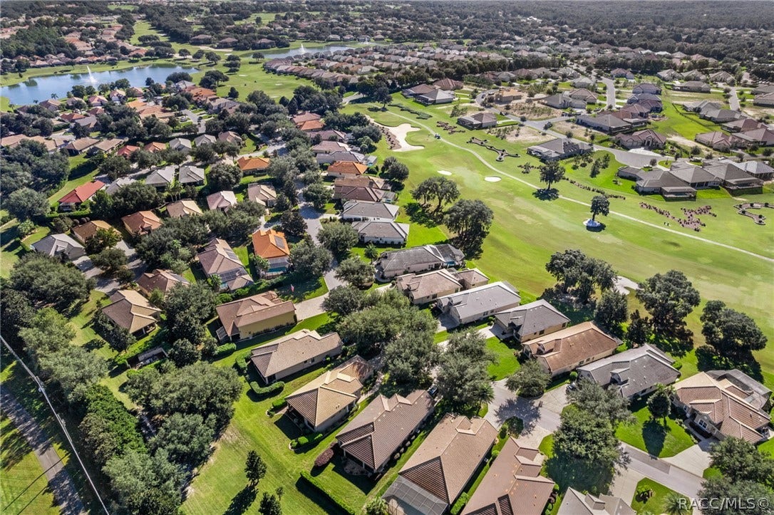 Expanded aerial view looking east of this villa.