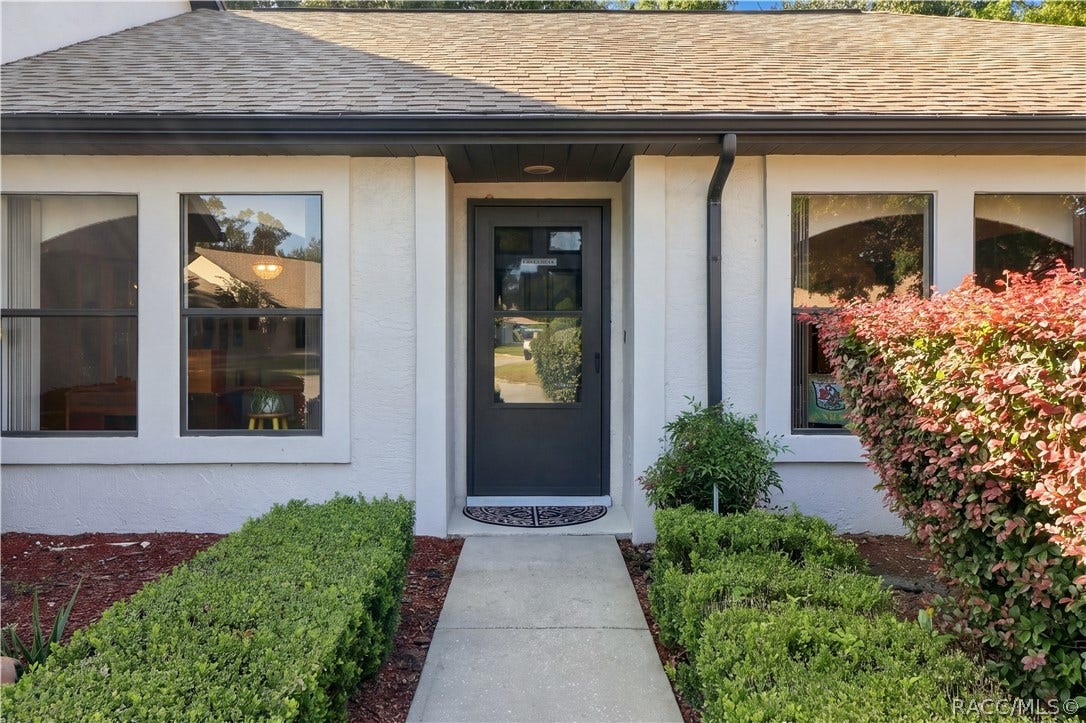 COME ON IN! Inviting COVERED FRONT ENTRY w/a charming walkway, decorative landscaping & contrasting dark front door!
