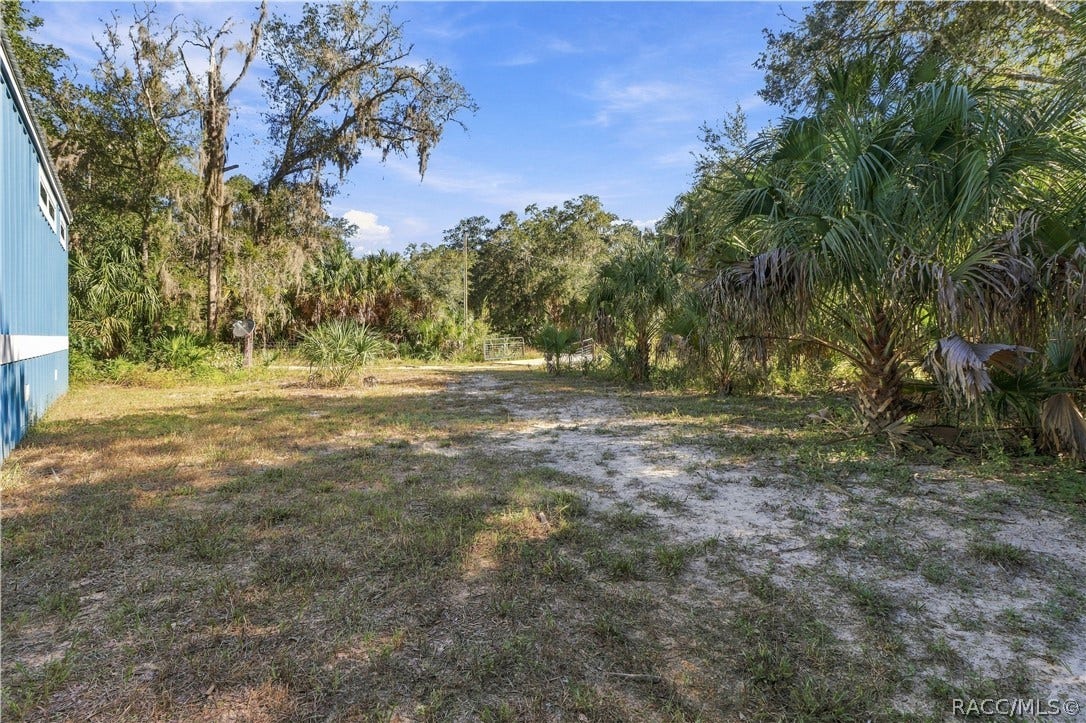7528 N Chabaud Terrace, Crystal River, FL 34428 BRING YOUR TOYS & ENJOY THE SPACE! The 1.42-ACRE FULLY FENCED PROPERTY offers open areas, mature trees, Florida palms & a gated entrance.