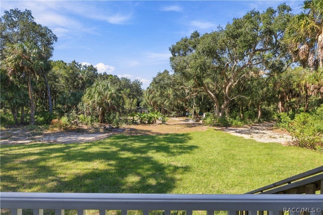 7528 N Chabaud Terrace, Crystal River, FL 34428 NATURE RIGHT OUTSIDE YOUR DOOR! Enjoy views of the expansive lawn, mature trees & Florida palms from the comfort of your front porch.