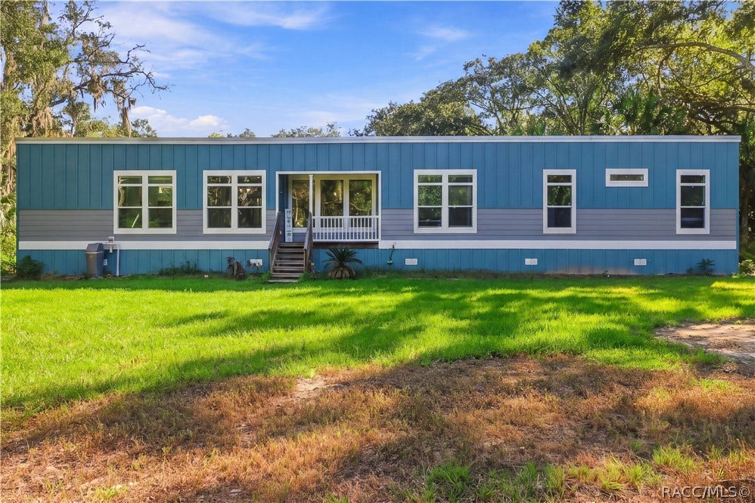 7528 N Chabaud Terrace, Crystal River, FL 34428 WELCOME HOME TO THE PICTURE-PERFECT COUNTRY SETTING! Attractive blue exterior, crisp white accents & generous green space give this 2024 home a fresh, welcoming appearance.