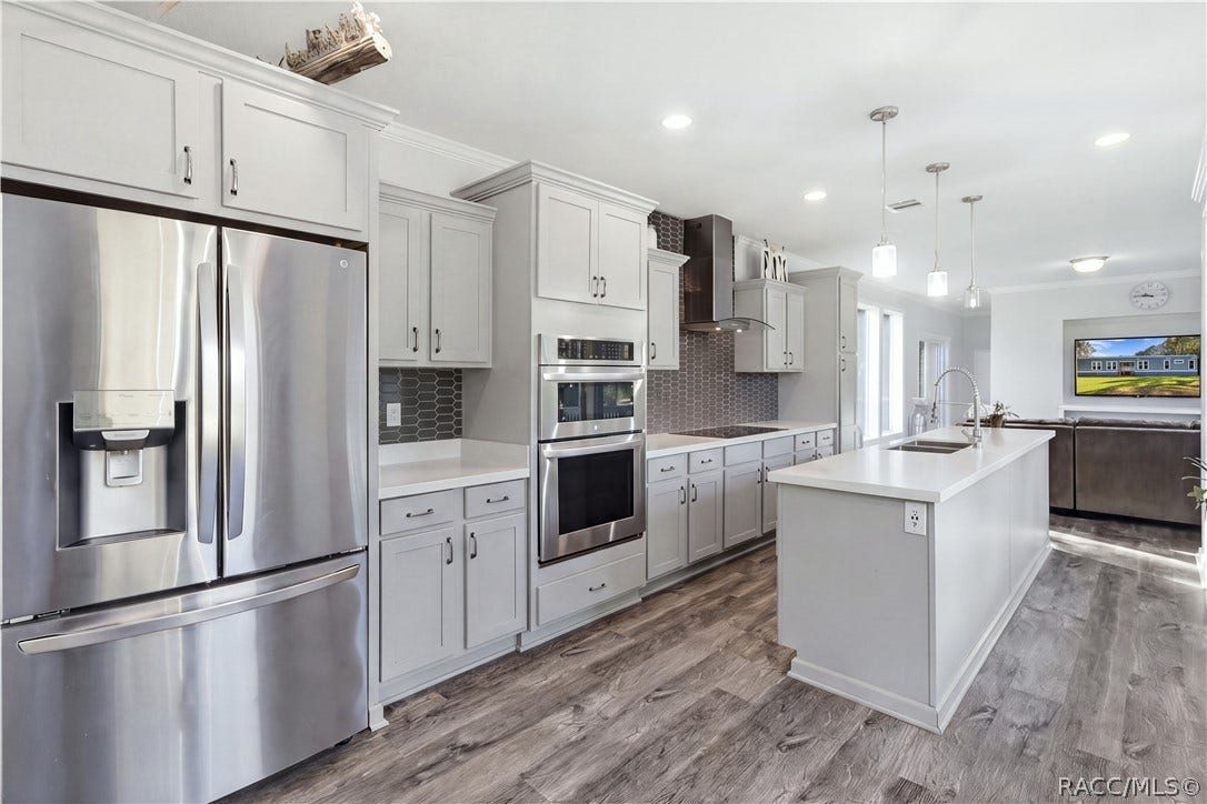 7528 N Chabaud Terrace, Crystal River, FL 34428 STYLE MEETS FUNCTION! The thoughtfully designed kitchen features GRAY CABINETRY, a DOUBLE-BASIN SINK, sleek spring-style faucet & large windows overlooking the beautiful outdoors.