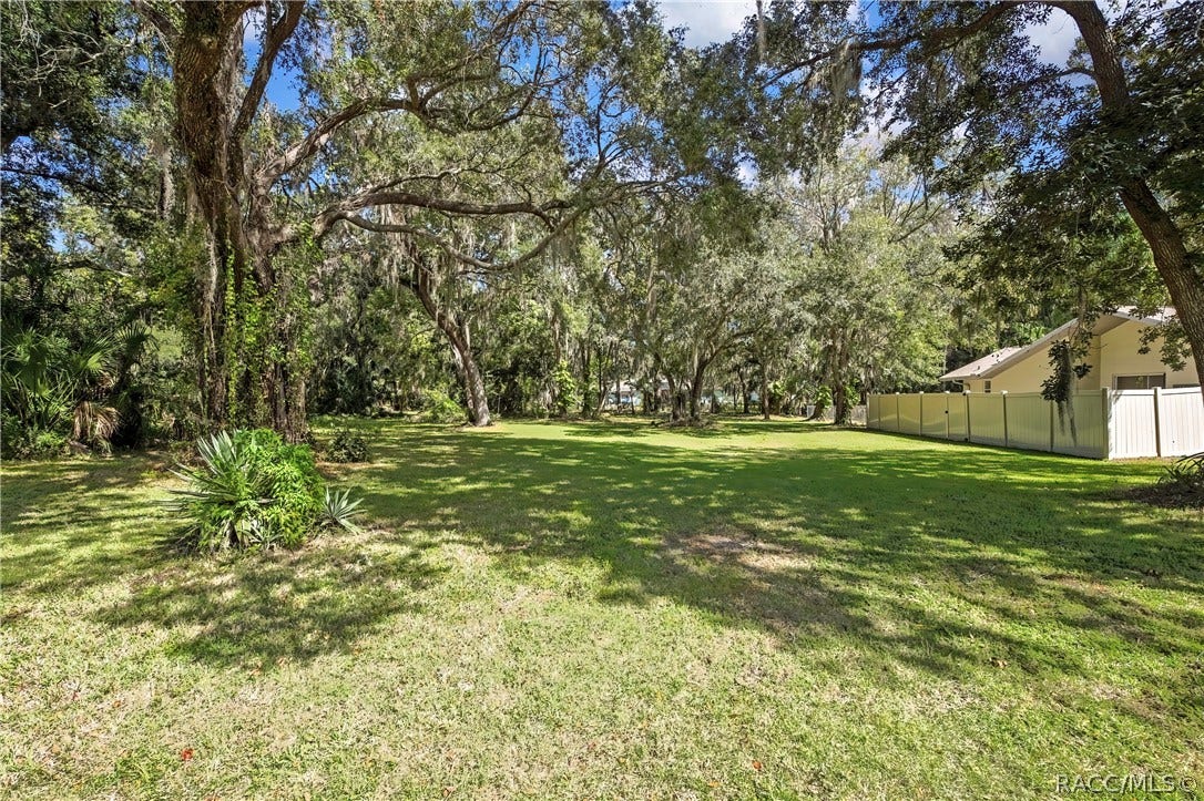 4737 S Sawmill Way, Homosassa, FL 34448 Floor plan showing 3 bedrooms, 2 bathrooms, living room, kitchen, foyer, garage, decks, enclosed patio and covered patio.