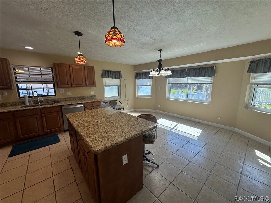 3409 W Corrie Leath Lane, Dunnellon, FL 34433 Island with bar seating and eat in kitchen space