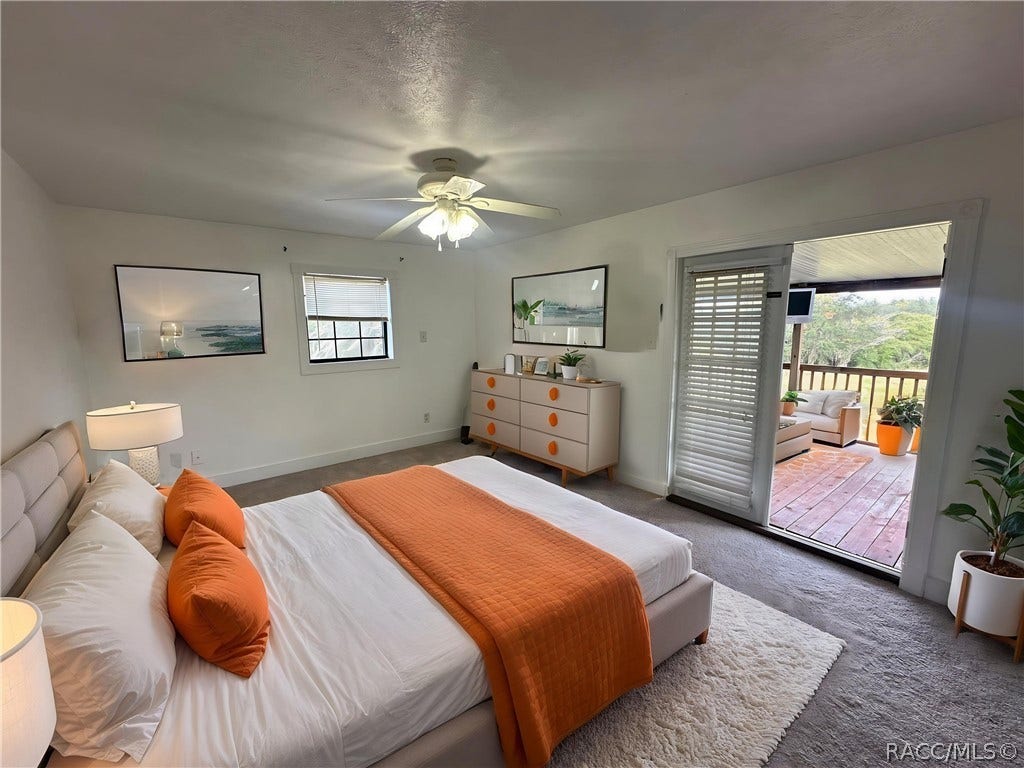 3409 W Corrie Leath Lane, Dunnellon, FL 34433 Master bedroom with door to back deck (virtually staged)