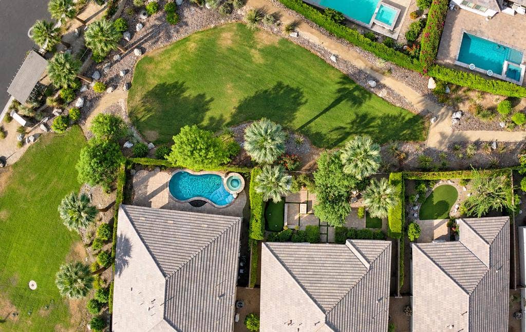 50845 Harps Canyon Drive, Indio, CA 92201 Polished aerial estate with turquoise po