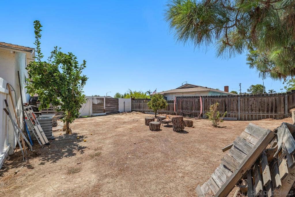 Side yard w/ ample space and direct street access for an ADU or RV parking