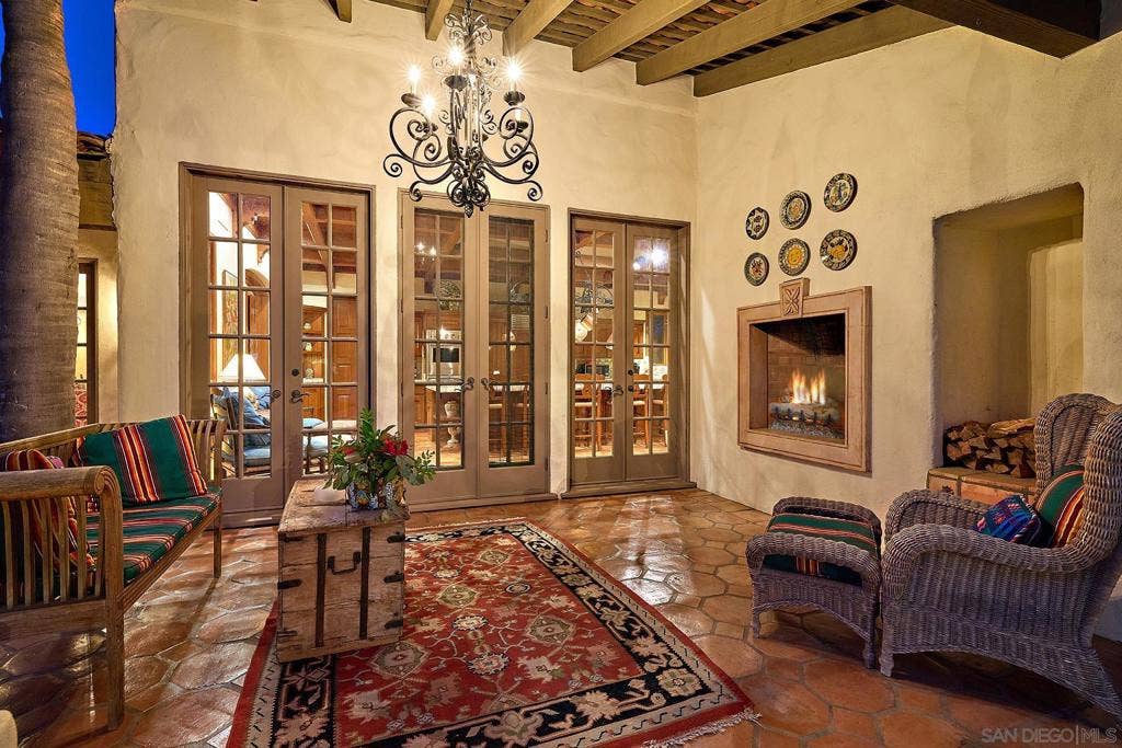 Indoor/Outdoor living with fireplace off the kitchen.