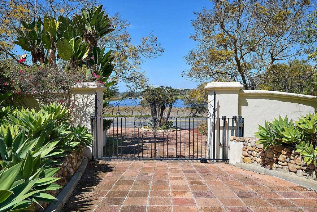 Your view leaving this secure very private residence.  98 year old Lilian Rice custom houses rarely come on the market.  Own this 3 acre, 8000 sf masterpiece in the heart of the beautiful RSF Covenant. Beautiful memories are waiting....