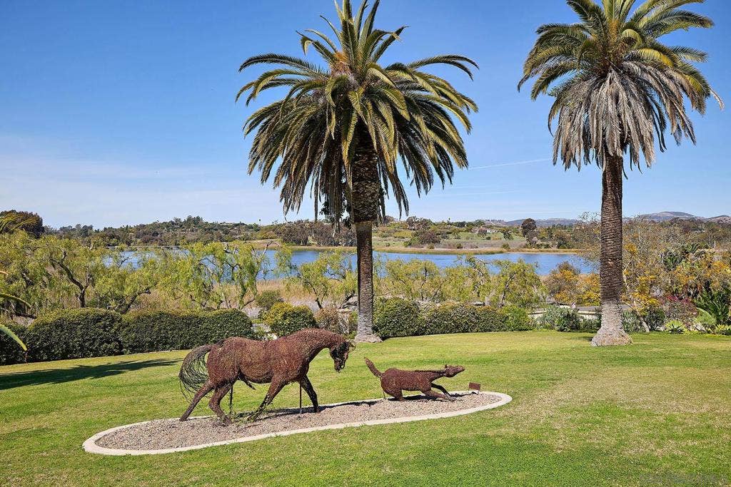 On the front lawn a barbed wire sculpture, titled Mare and Foal, by P. J. Mene serves as a nod to the equestrian history of Rancho Santa, with beautiful lake views.