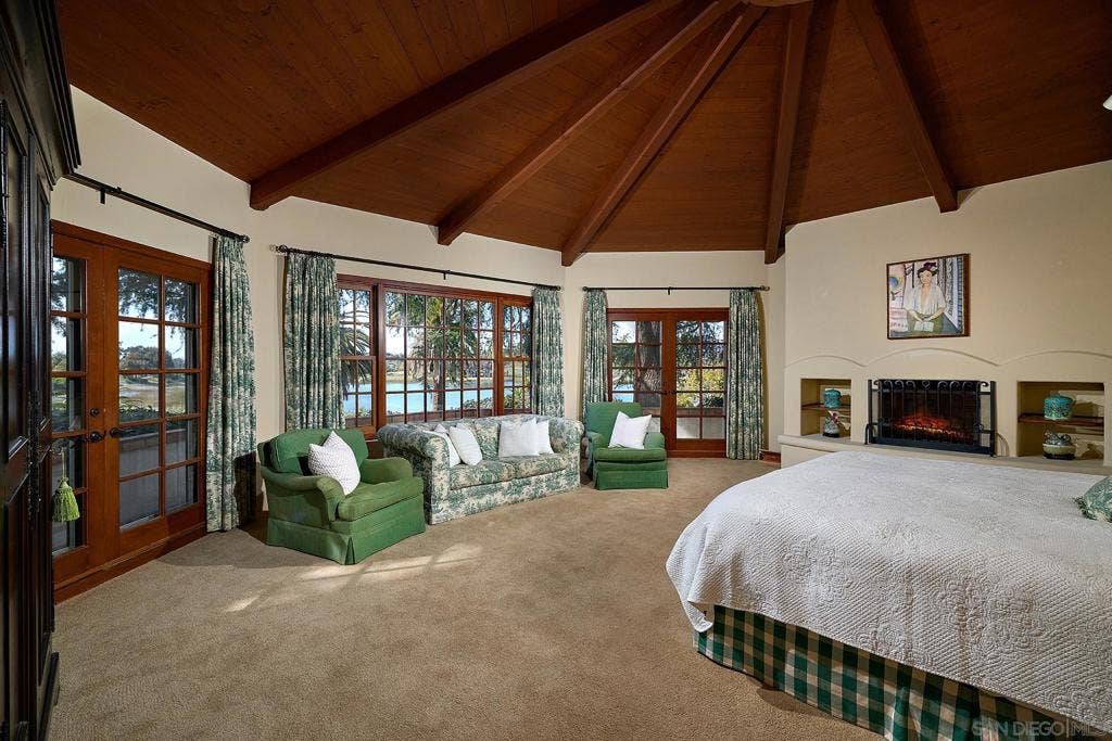 The primary suite is a tranquil retreat with beautiful lake views and dramatic sunsets. Ensuite are his and hers bathrooms and dressing rooms, including a fireplace and sauna.