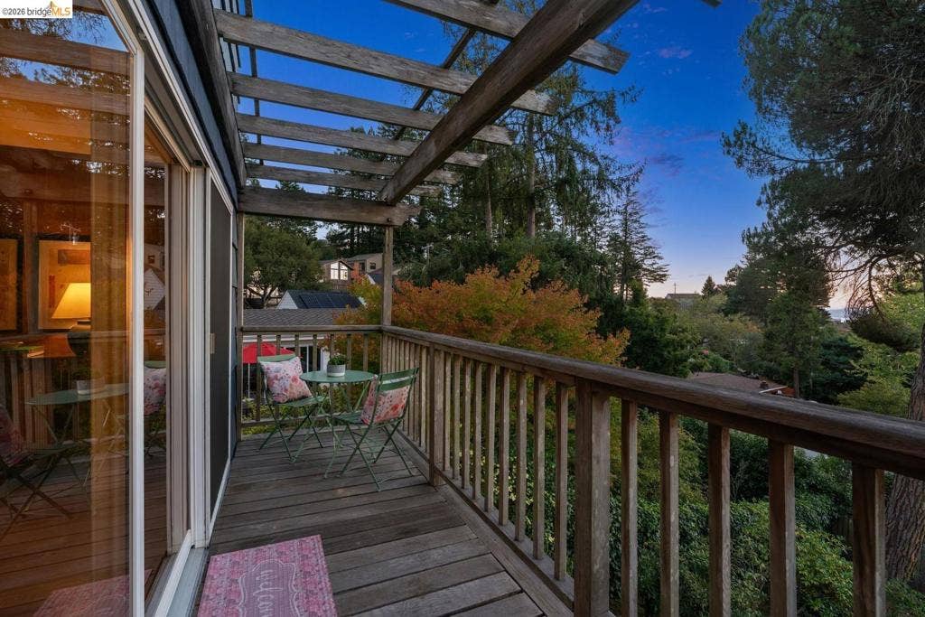 Wood-finish deck with a pergola and wood railings