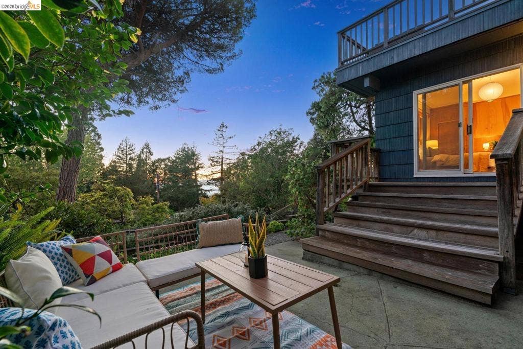 Multi-level decking and outdoor patio with a concrete surface