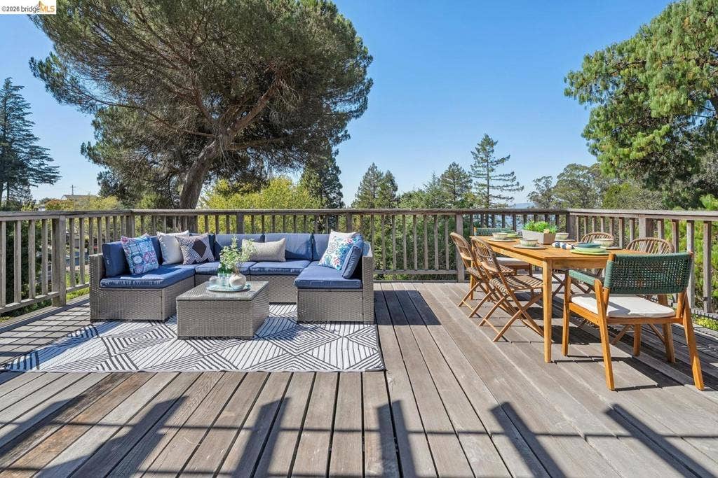 Expansive wood deck with a full-height wood railing
