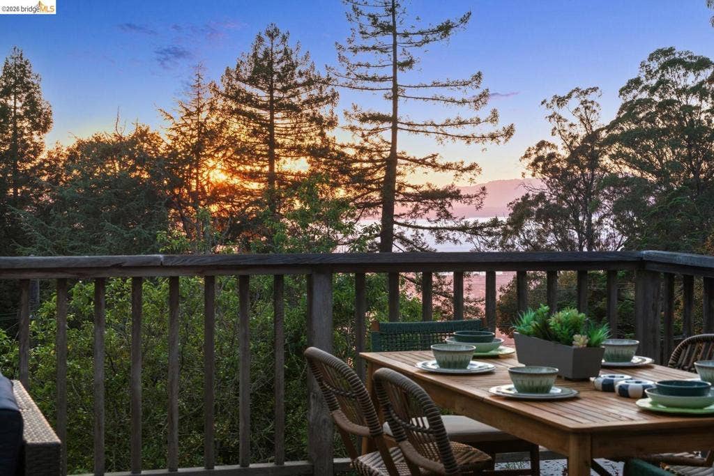 Deck with wood railing and distant mountain scenery