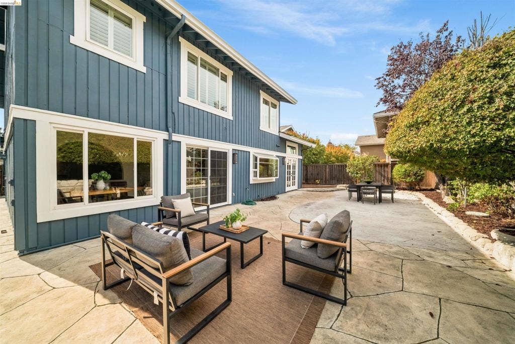 Expansive flagstone patio with a distinct circular pattern