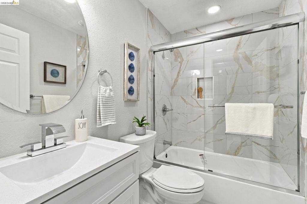 Vanity with a single basin sink and chrome faucet