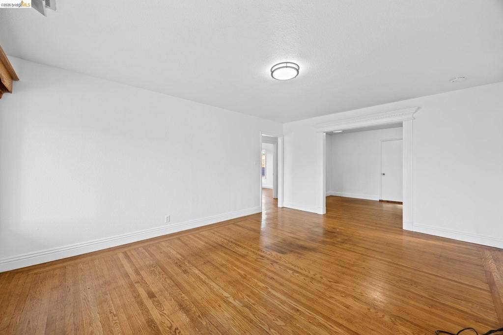 2240 Lessley Ave, Castro Valley, CA 94546 Hardwood flooring, recessed lighting, and bright white walls