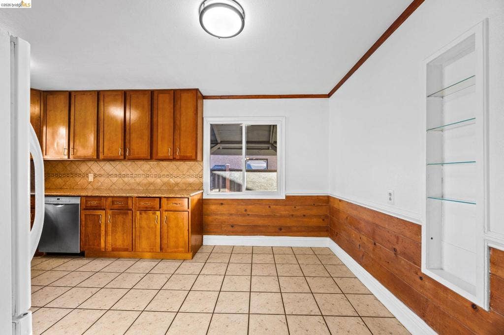 2240 Lessley Ave, Castro Valley, CA 94546 Kitchen with wood-finish cabinetry, tile flooring, and integrated dishwasher