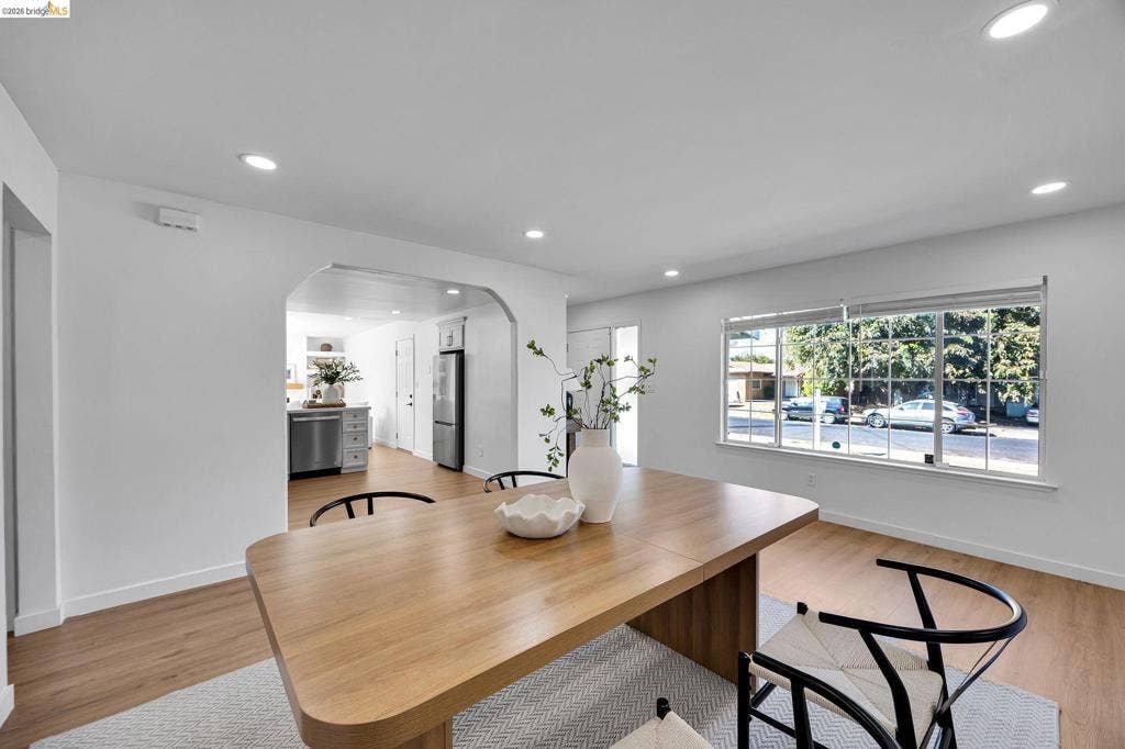 1509 Poppy Way, Antioch, CA 94509 Recessed lighting illuminates wood-finish flooring and a wide window