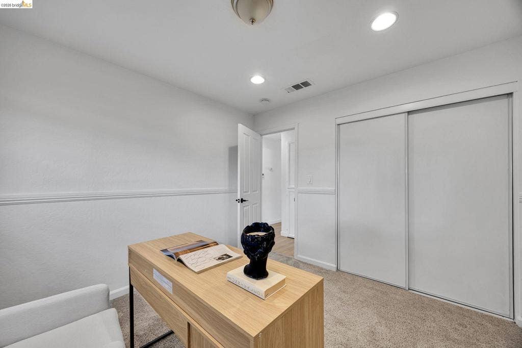 1509 Poppy Way, Antioch, CA 94509 Neutral carpeting throughout, recessed lighting, and a white interior door with black hardware