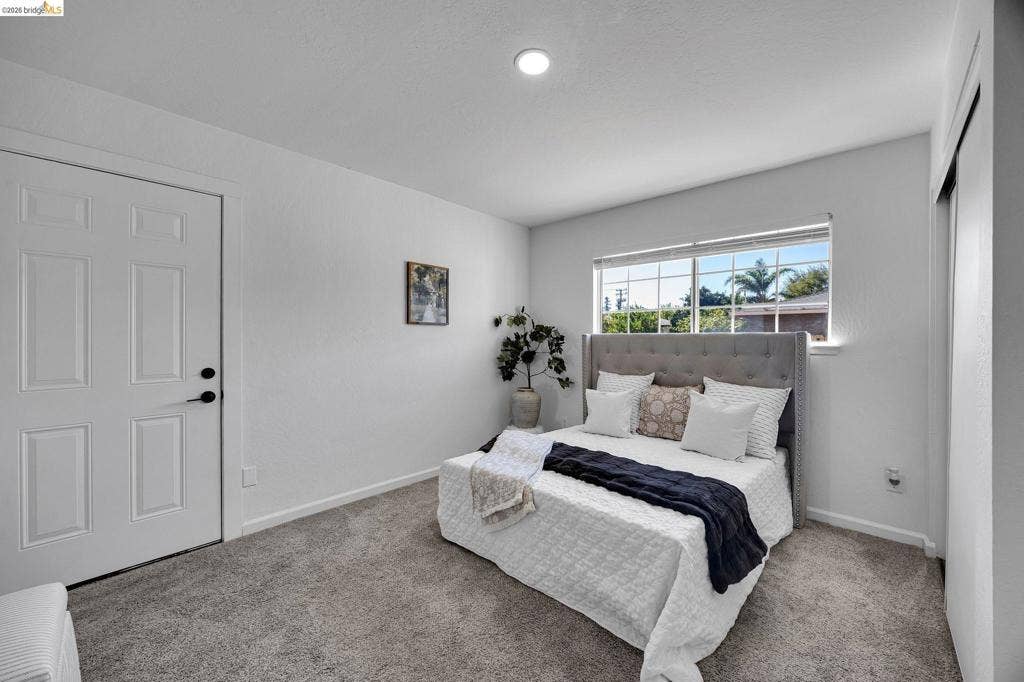 1509 Poppy Way, Antioch, CA 94509 Recessed lighting, plush carpet flooring, paneled interior door with dark hardware, window with white blinds, and sliding closet doors