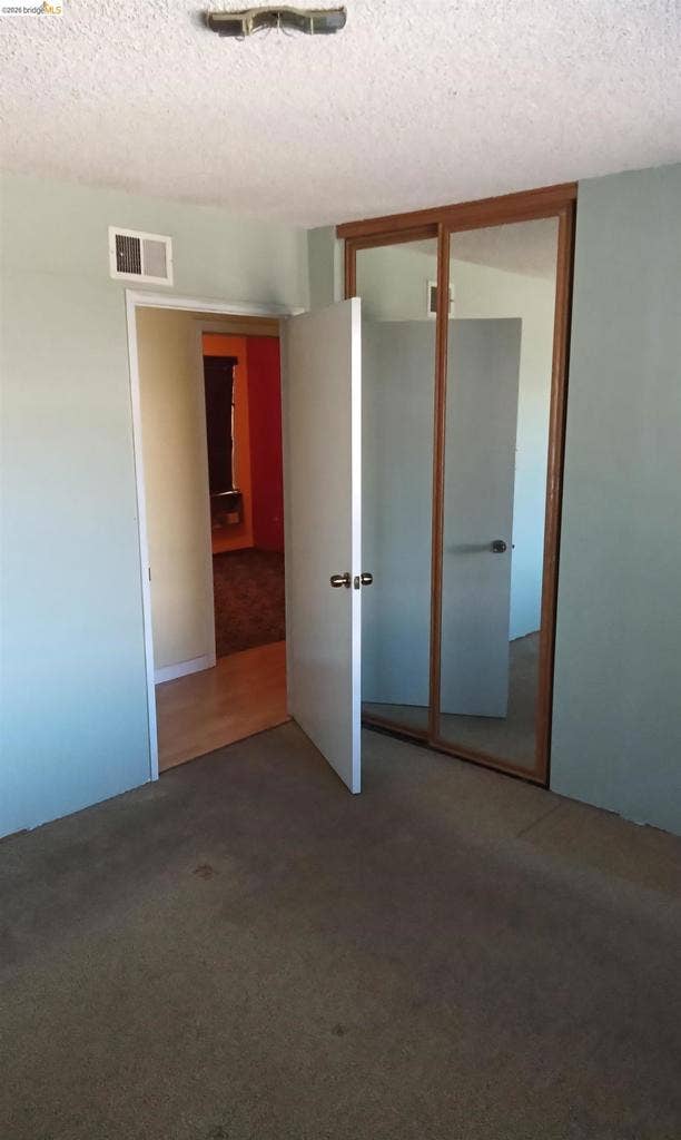 145 Viking Way, Pittsburg, CA 94565 Sliding mirrored closet doors, paneled interior doors, and overhead lighting