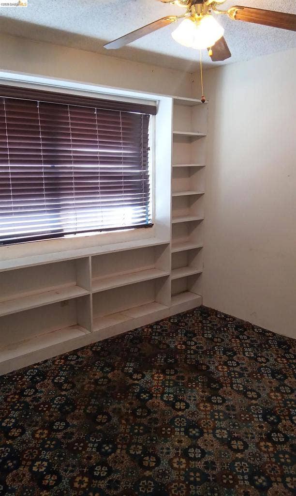 145 Viking Way, Pittsburg, CA 94565 Built-in shelving, integrated window storage, ceiling fan, and window blinds