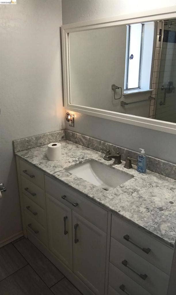 145 Viking Way, Pittsburg, CA 94565 Vanity with a light-toned countertop, undermount sink, and dark-toned faucet