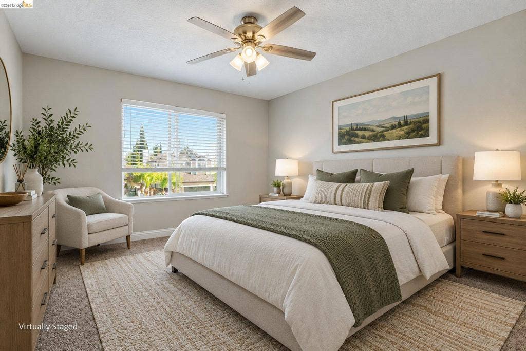 304 Greystone Dr, Antioch, CA 94509 Neutral-toned room featuring a central ceiling fan with integrated lighting, wall-to-wall carpeting, and a large window with horizontal blinds
