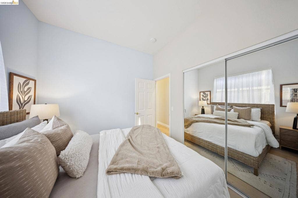 5503 Rainbow Cir, Santa Rosa, CA 95409 Bedroom featuring high ceilings, neutral wall tones, and floor-to-ceiling sliding mirror closet doors