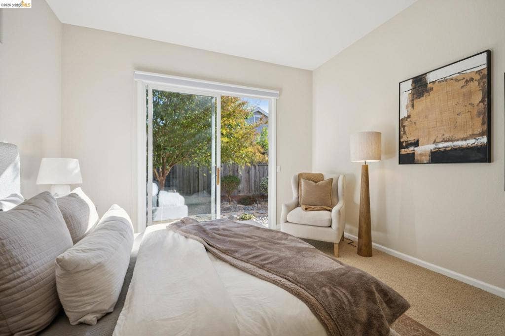 5503 Rainbow Cir, Santa Rosa, CA 95409 Sliding glass door with white frame and neutral carpeting