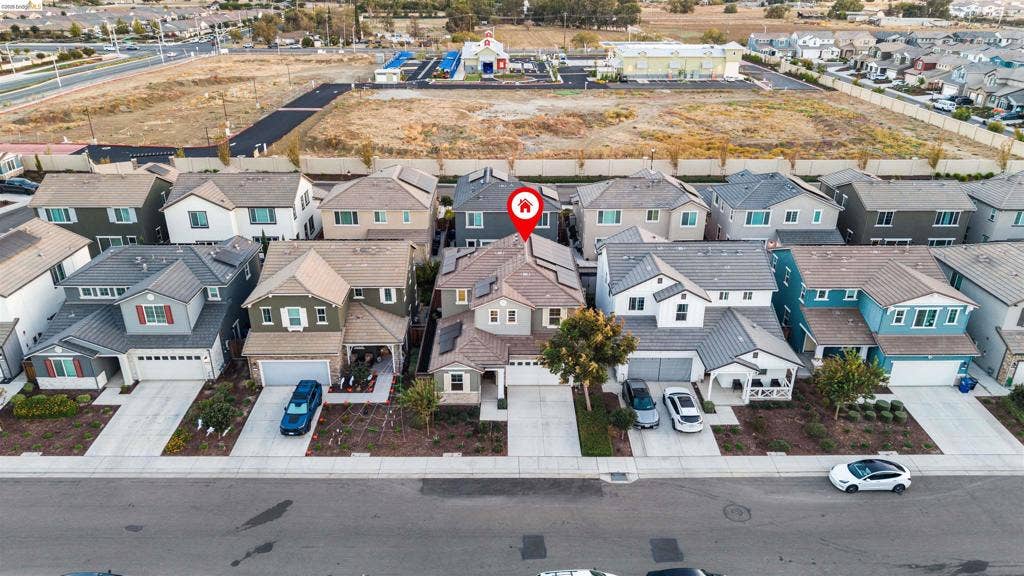 539 Gemstone Way, Oakley, CA 94561 Two-story residence featuring a tile roof, solar panels, attached multi-car garage, and a concrete driveway