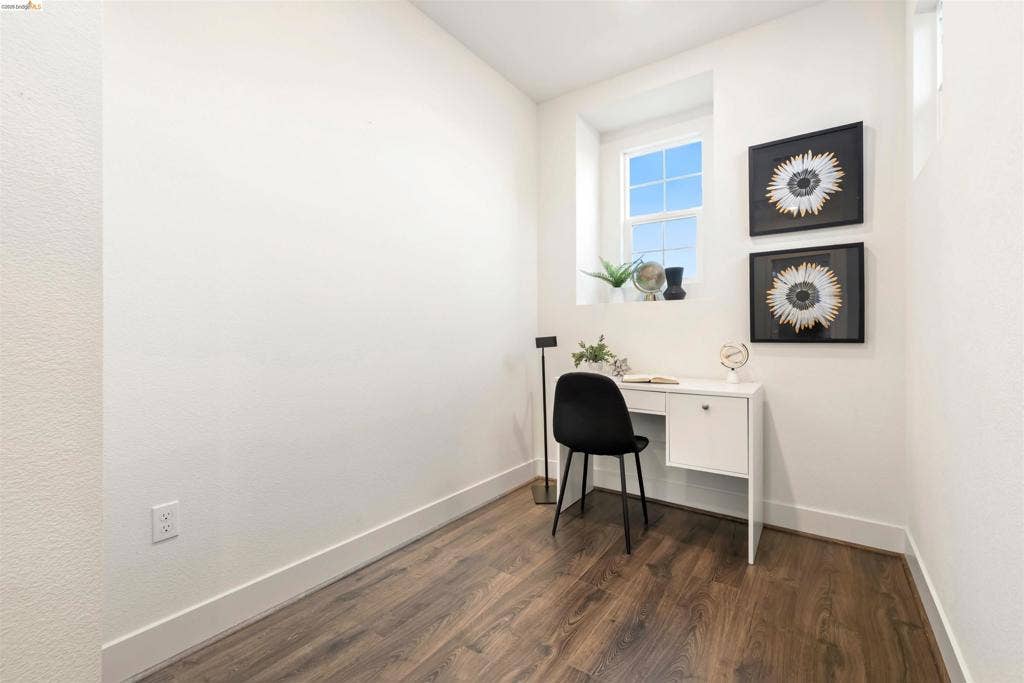 539 Gemstone Way, Oakley, CA 94561 Interior room featuring wood-finish flooring, crisp white walls, and a recessed window with a grid pane