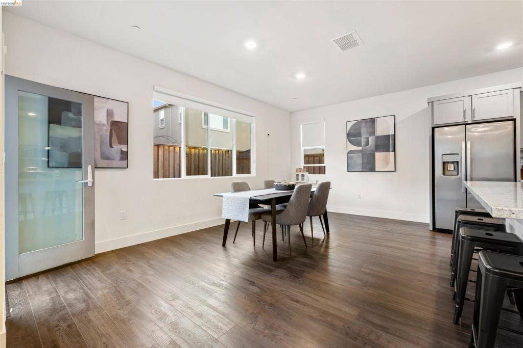 539 Gemstone Way, Oakley, CA 94561 Open-concept interior featuring wood-finish flooring, recessed lighting, and a glass-paneled door